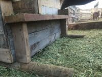 Having a goat feeder that wastes as little hay as possible is so important! Read more on How to Build a Goat Feeder Using Pallet Boards